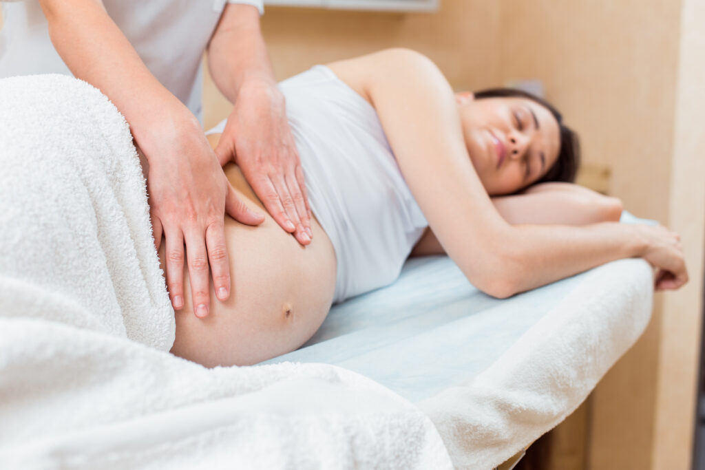 pregnant woman getting massage therapy Washington DC